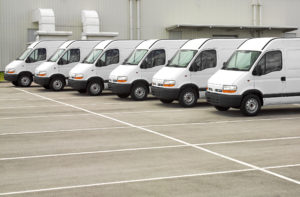 fleet of white vans in parking lot Lake Arbor Automotive & Truck Westminster Colorado