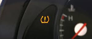 close up of tire pressure indicator on car dash Lake Arbor Automotive Westminster