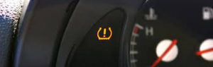close up of tire pressure indicator on car dash Lake Arbor Automotive Westminster