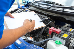 mechanic performing vehicle inspection Lake Arbor Automotive & Truck Westminster Colorado