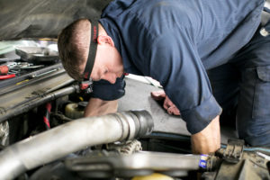 mechanic performing tune up Lake Arbor Automotive & Truck Westminster Colorado